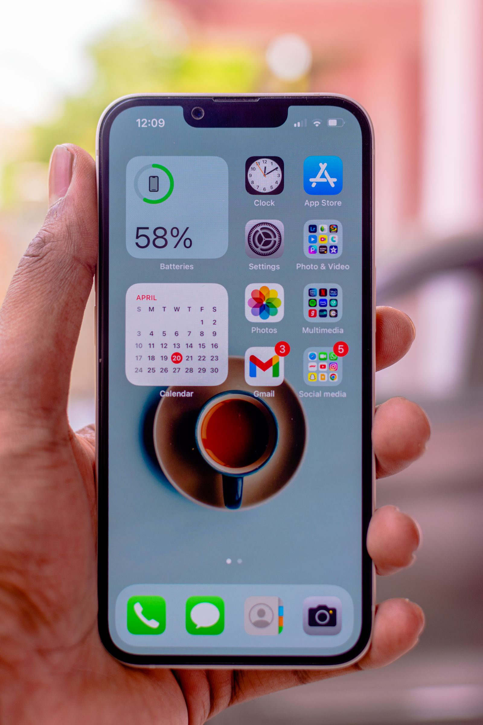 A real Apple iPhone held in a hand
